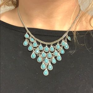 Beautiful silver necklace with Turquoise gems.
